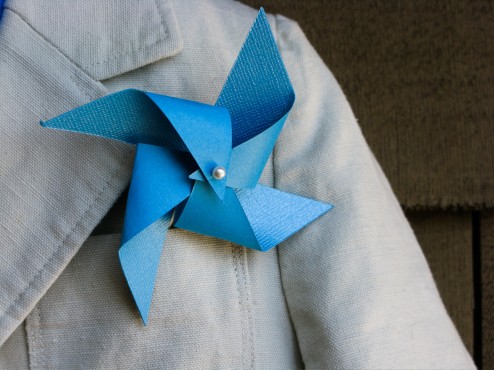 child-size blue pinwheel boutonniere close-up