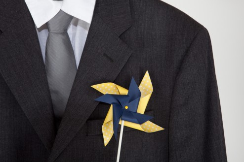 Adult Pinwheel Boutonniere Yellow and navy adult pinwheel boutonniere